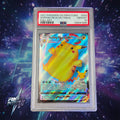A graded Pokémon trading card in a clear PSA slab, featuring Surfing Pikachu VMAX from the 2021 Pokémon Celebrations set. The slab label shows a Gem Mint 10 grade.